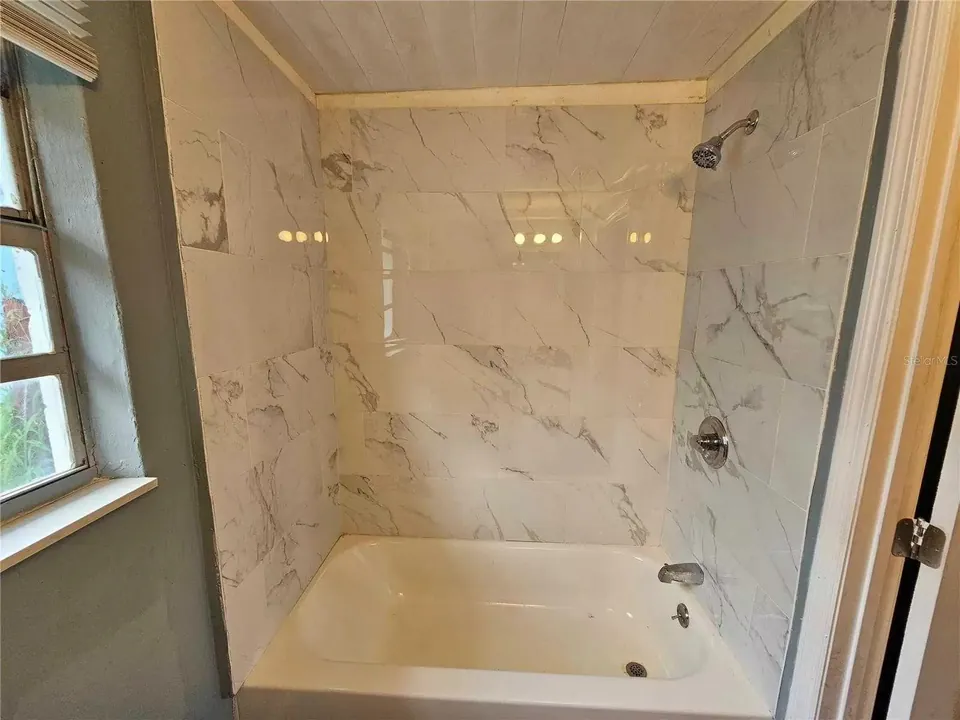 Tub shower at 129 Florida Drive