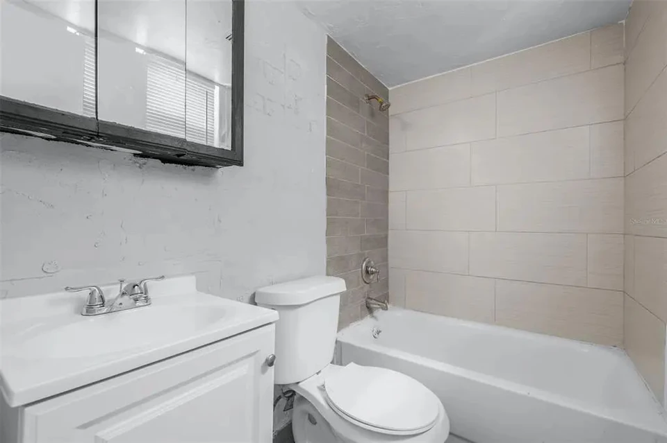 Bathroom with bathtub and vanity at 1311 Prescott Street S