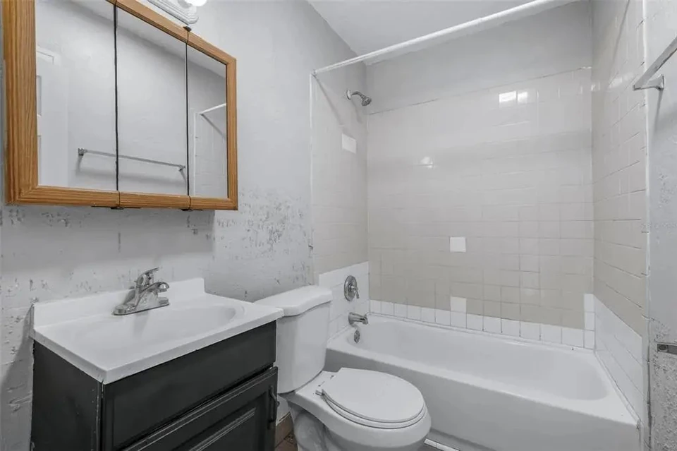 Second bathroom with bathtub and vanity at 1311 Prescott Street S