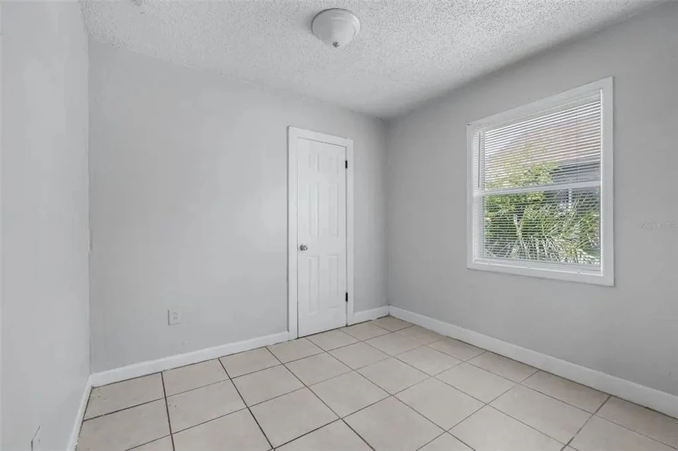 Bedroom with closet and window at 1311 Prescott Street S