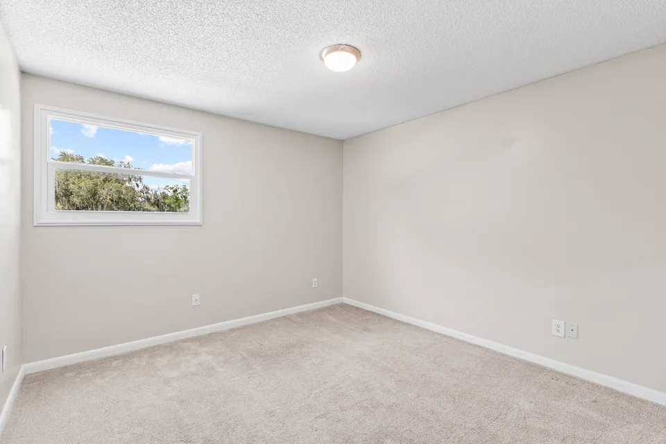 Additional bedroom with wood-look flooring