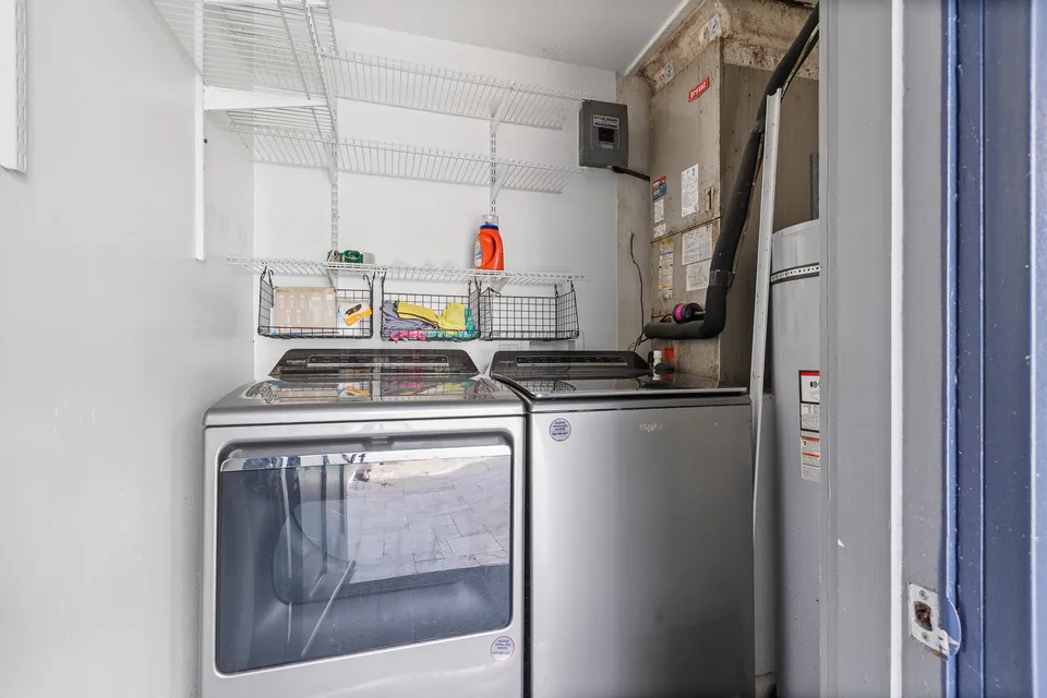 Interior laundry room with storage