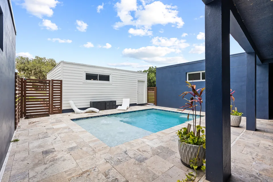 Screened pool and paved pool deck