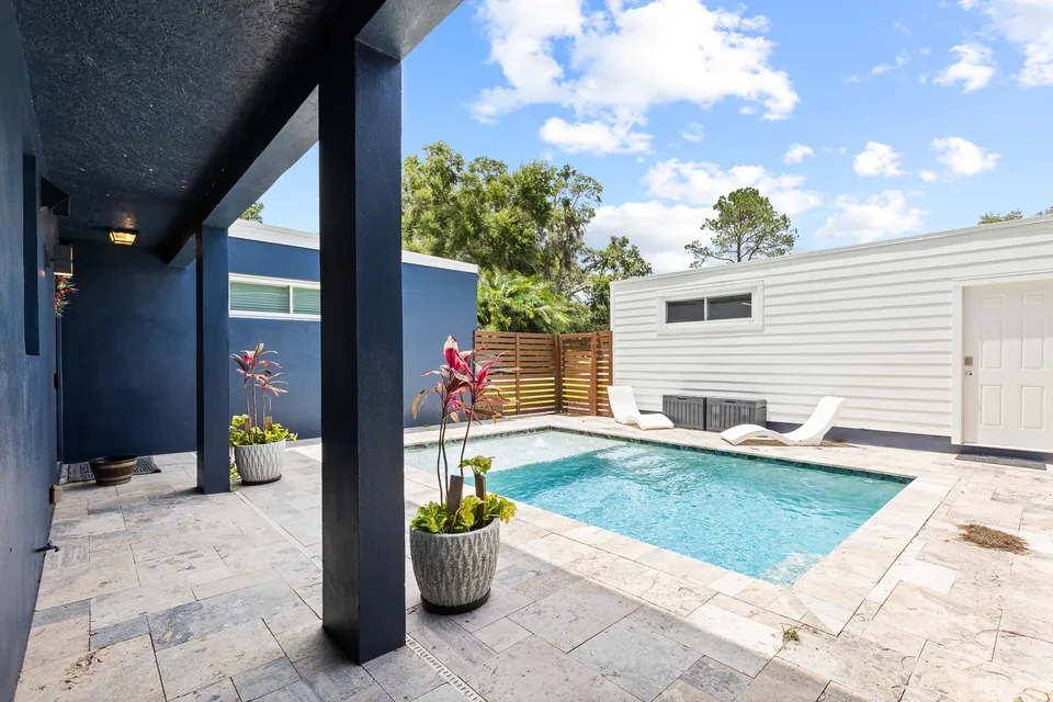 Screened saltwater pool with Lake Keene beyond