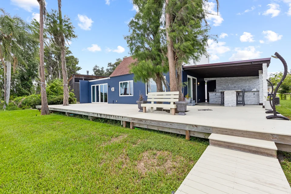 Rear exterior, deck and lakefront yard