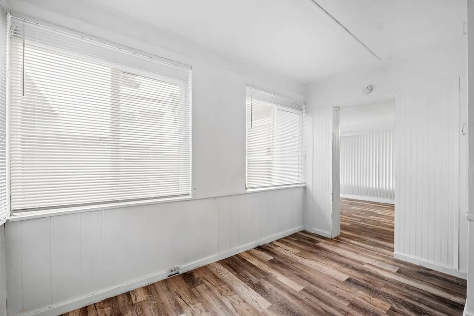 Bright dining area with wraparound windows