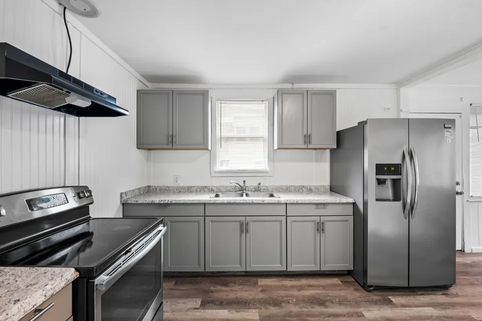 Kitchen cabinets, range, and refrigerator
