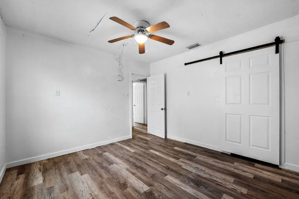 Bedroom with barn-style closet door