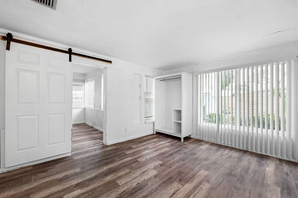 Bedroom with wide windows and closet
