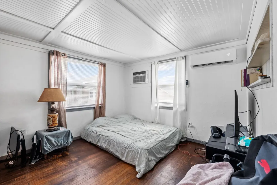 Occupied bedroom with windows