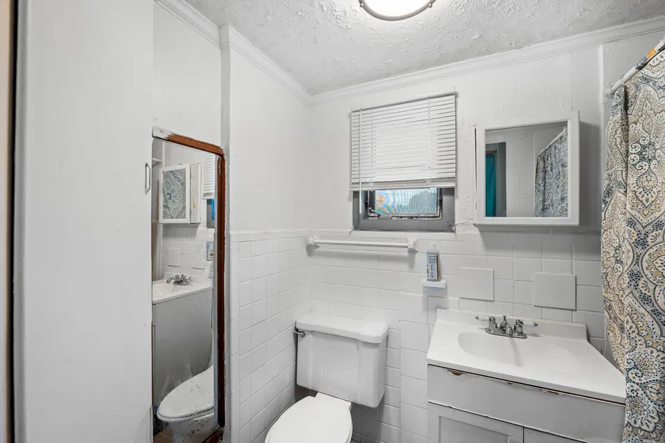 Bathroom with shower and vanity