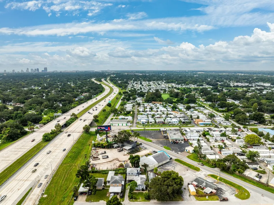 Aerial view toward nearby highway and neighborhood