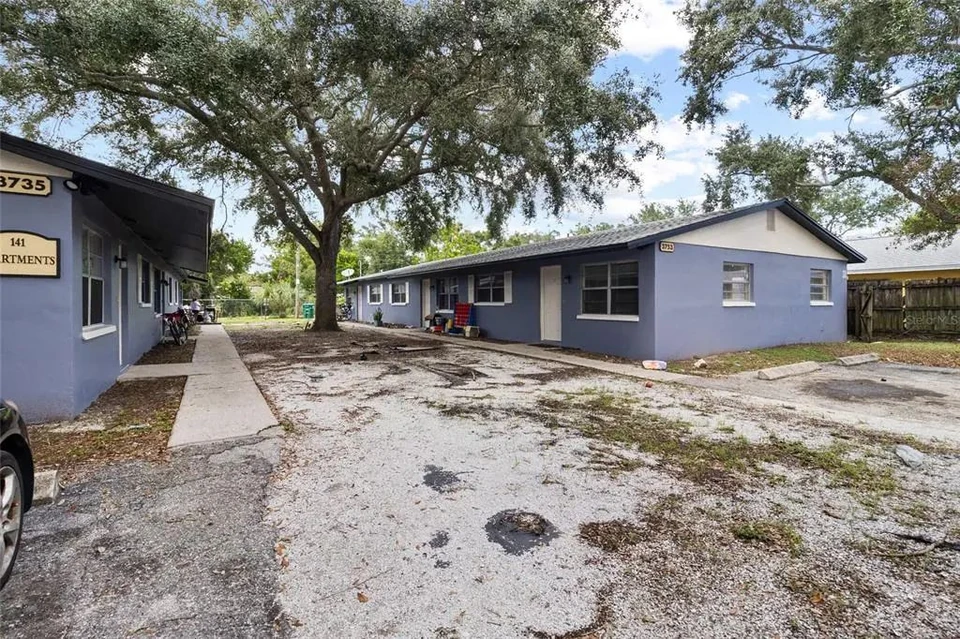 Exterior view across the adjacent triplex setting at 3735 141st Place