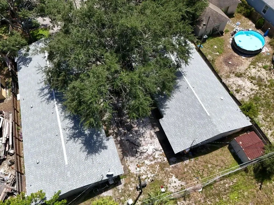 Aerial view of the triplex and surrounding lot at 3735 141st Place