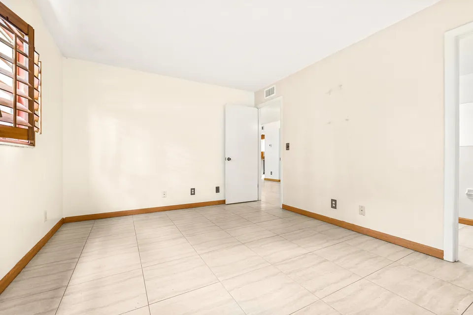 Tiled bedroom with window