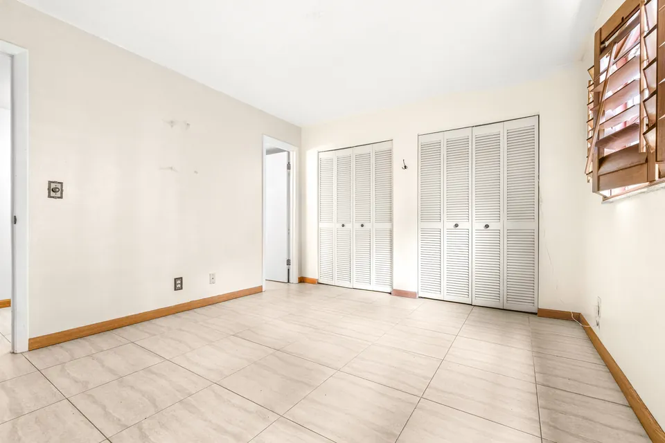 Bedroom with sliding closet doors