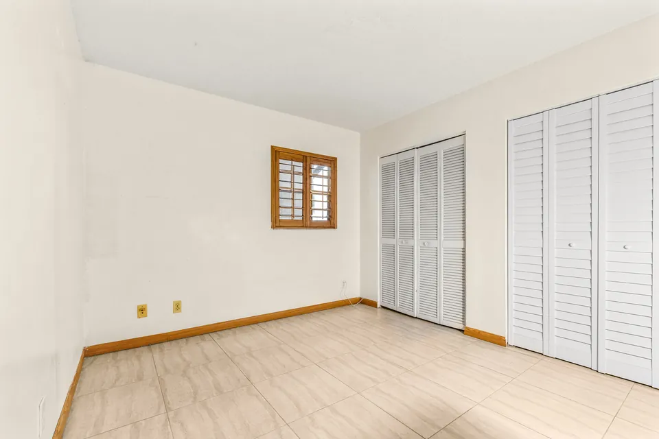 Bedroom with window and closet