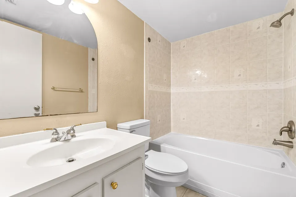 Bathroom with dual sinks and tub-shower