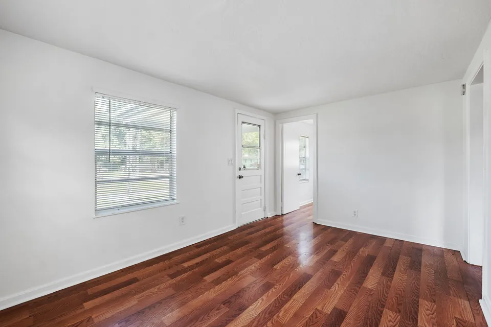 Living room with wood floor and two exterior doors