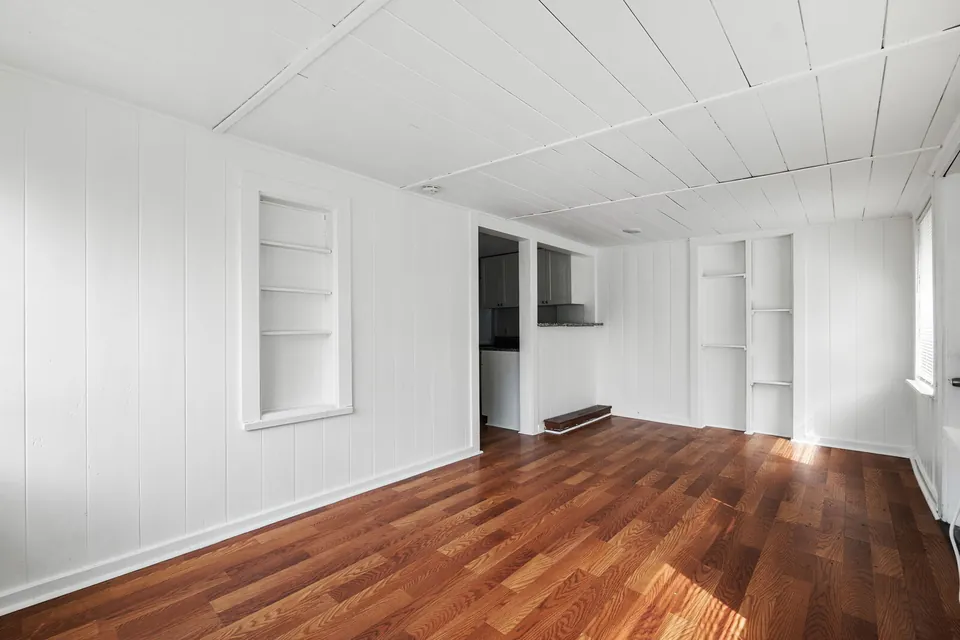 Enclosed living area with built-in shelves