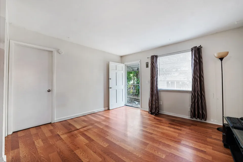 Living room with rear entry door