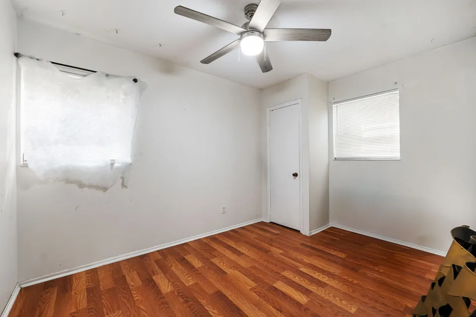Bedroom with wood floor and ceiling fan