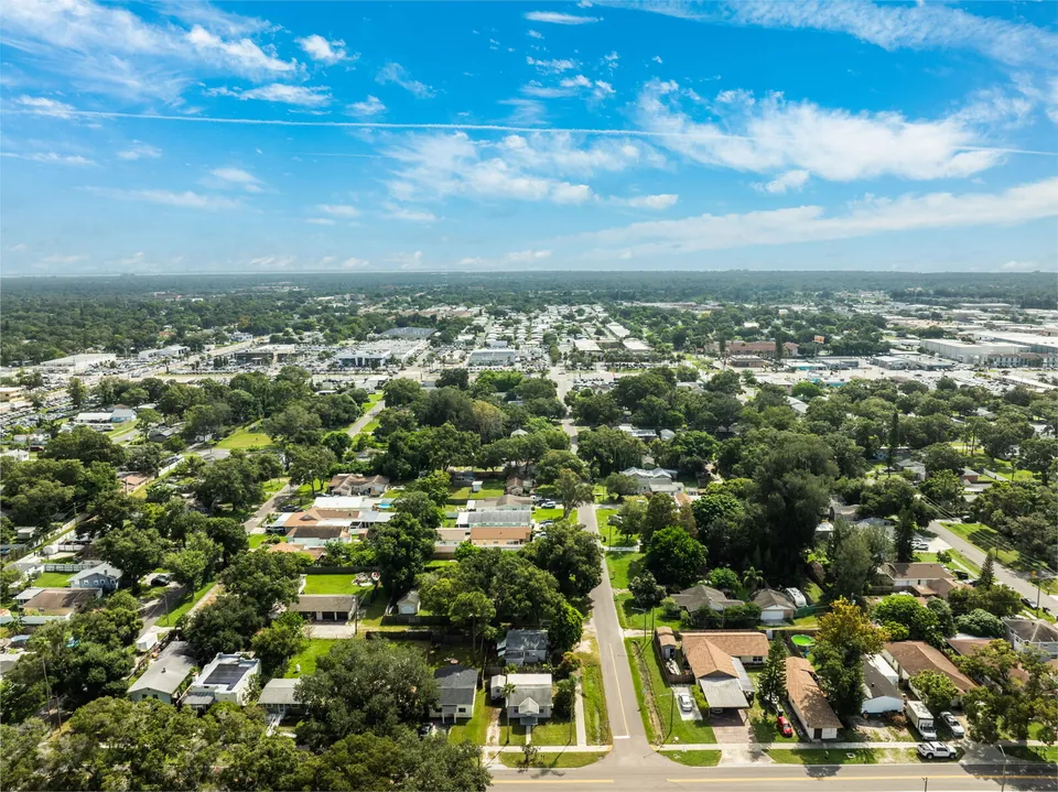Wide neighborhood aerial with distant skyline