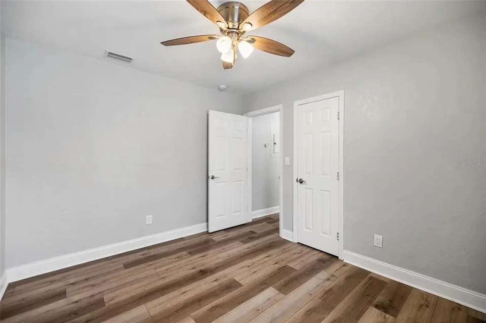 Bedroom with closet and adjoining doorway at 5907 N Ola Avenue