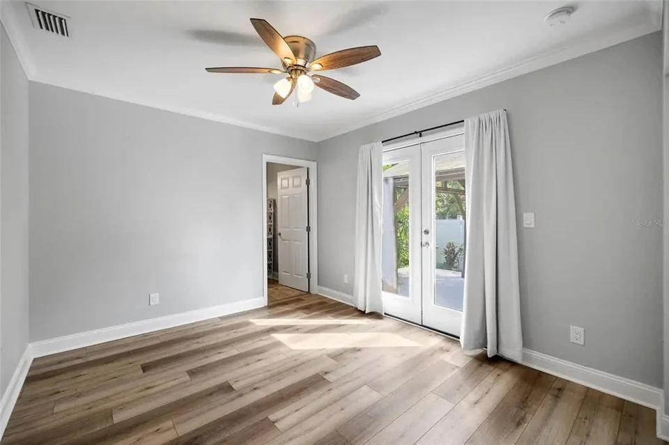 Bedroom with doors toward the backyard at 5907 N Ola Avenue
