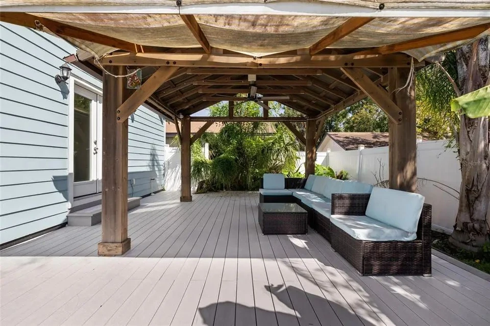 Covered backyard seating area at 5907 N Ola Avenue