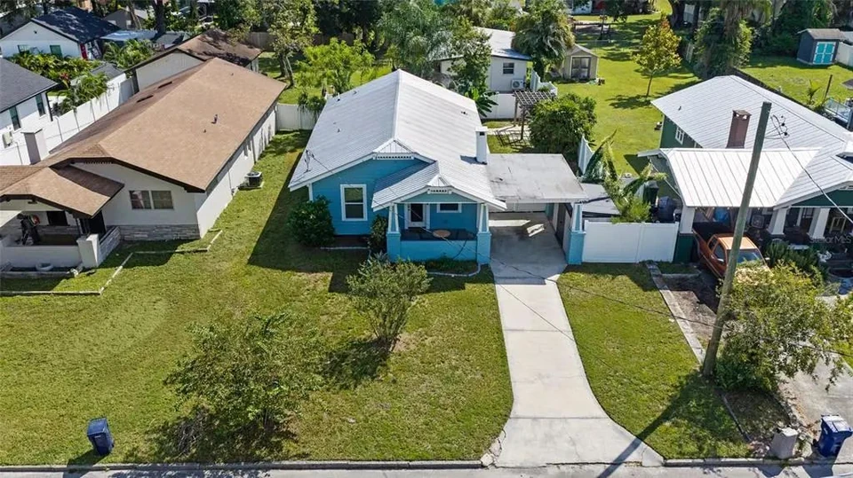 Aerial view of the home and driveway at 5907 N Ola Avenue