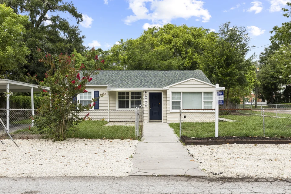 Front exterior of 6726 North 11th Street with white gravel landscaping