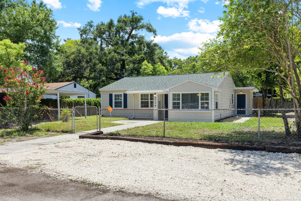 Front exterior and fenced yard