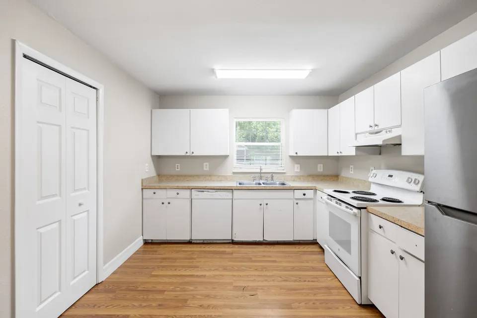 Kitchen cabinets, range, and pantry doors