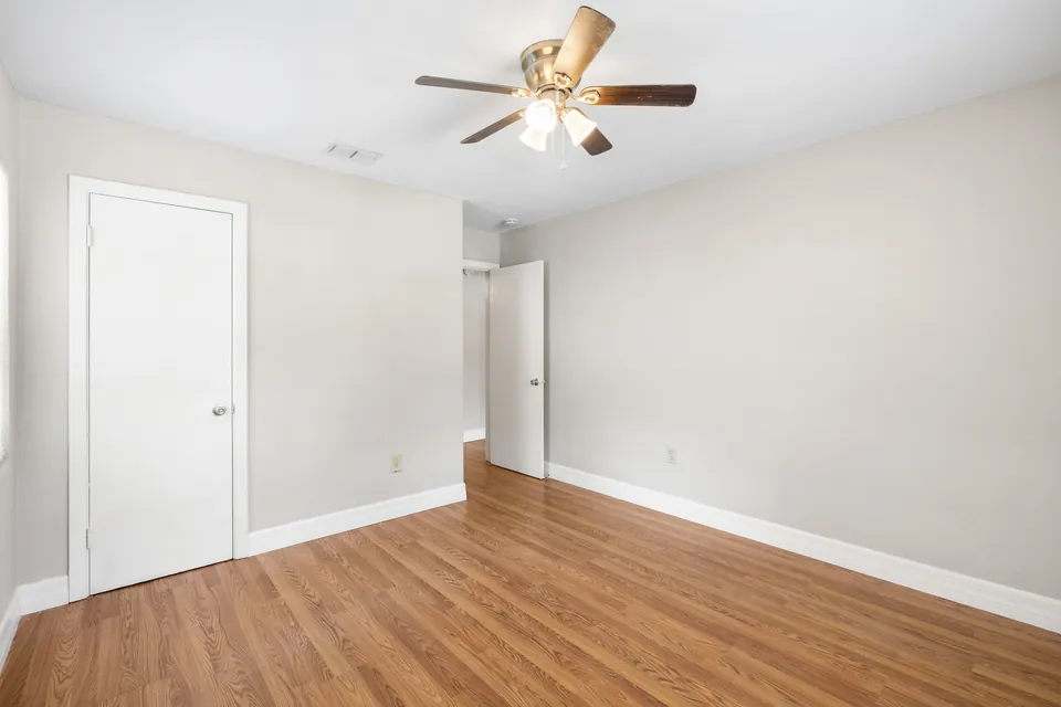Bedroom with window and closet