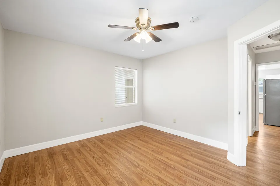 Bedroom with ceiling fan and doorway