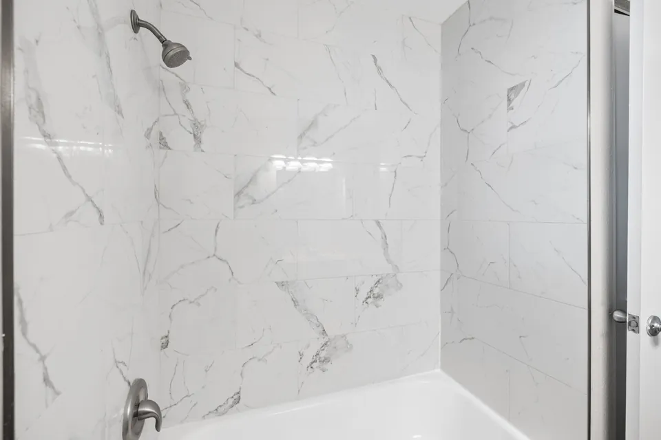 Marble-look tub-shower surround