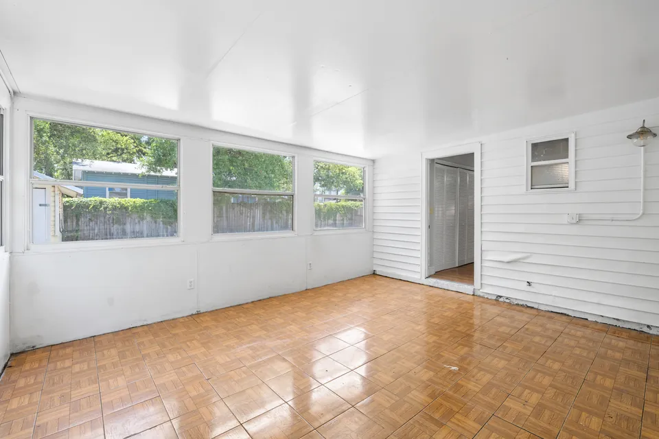 Enclosed rear room facing the backyard