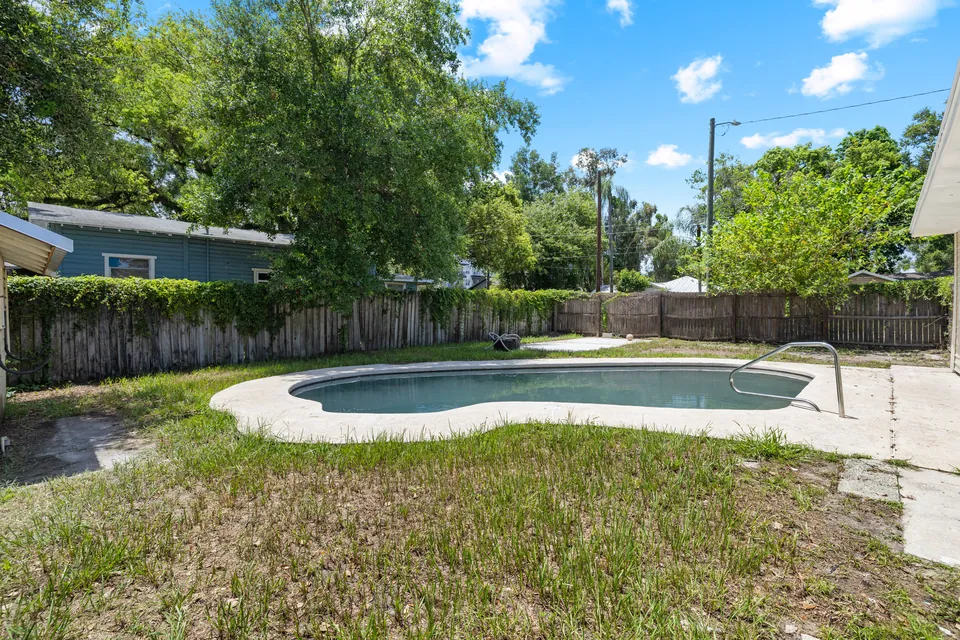 Swimming pool and fenced backyard