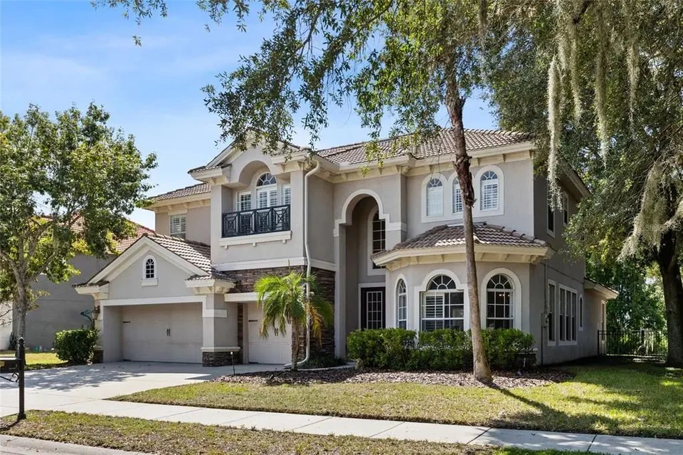 Front exterior of the two-story home at 9113 Creedmoor Lane