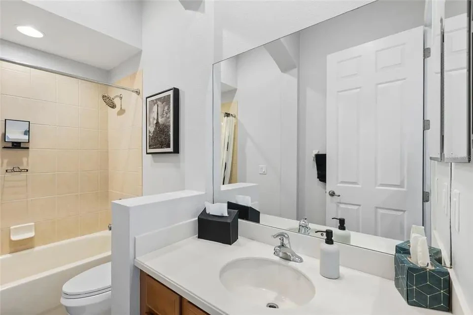 Bathroom with vanity and shower at 9113 Creedmoor Lane