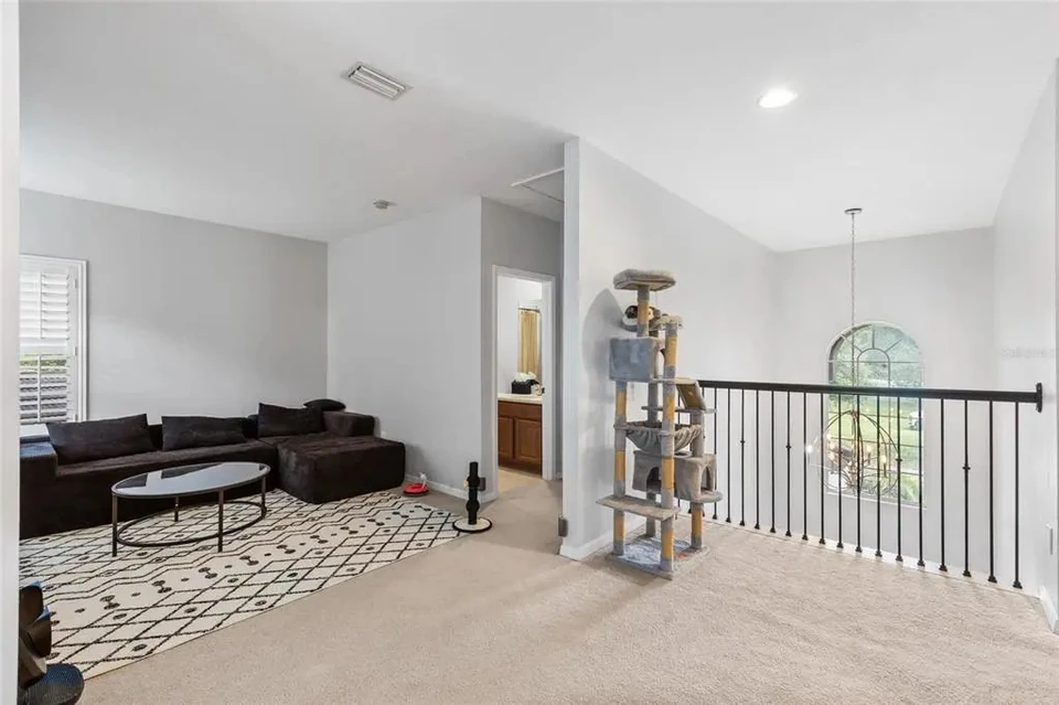 Upstairs loft overlooking the lower level at 9113 Creedmoor Lane