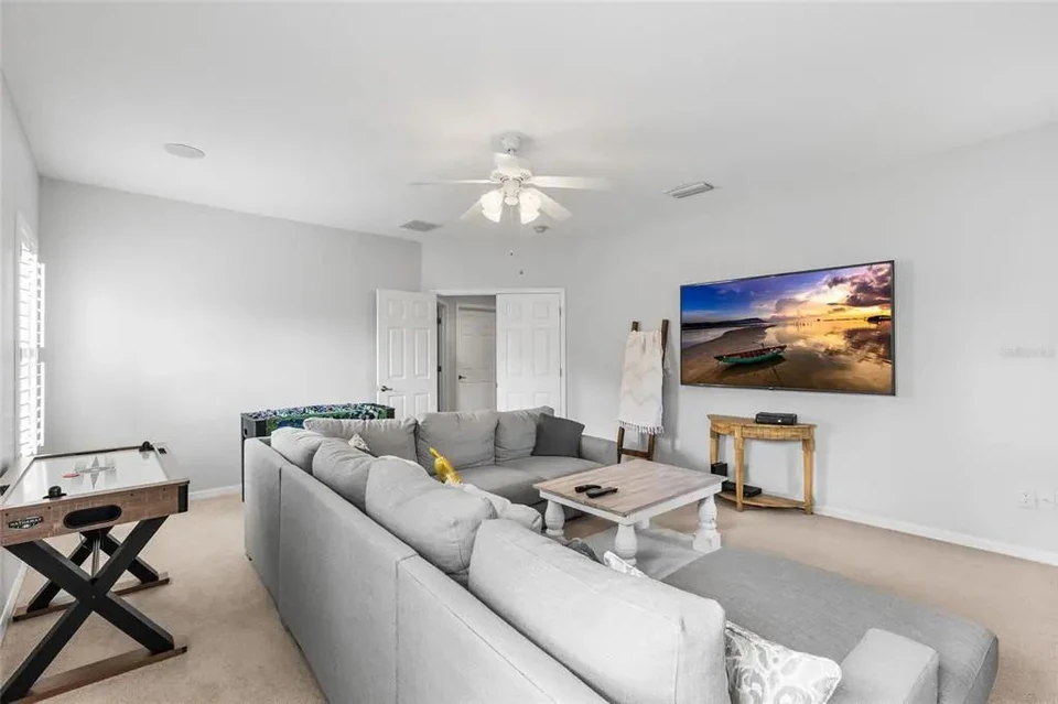 Media room with seating at 9113 Creedmoor Lane