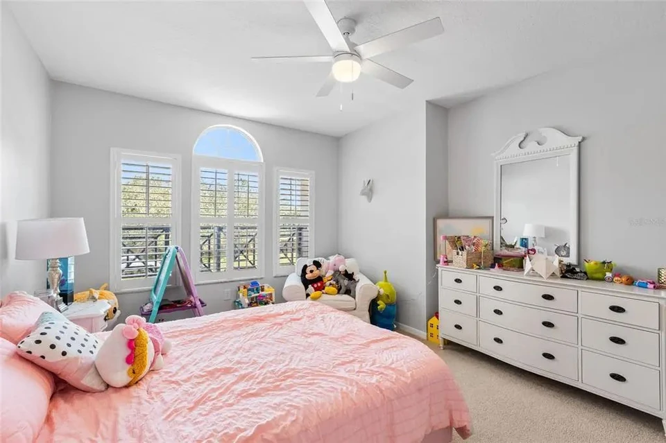 Bedroom with arched window at 9113 Creedmoor Lane