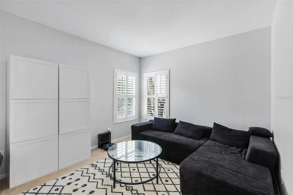 Bedroom with closet and sitting area at 9113 Creedmoor Lane