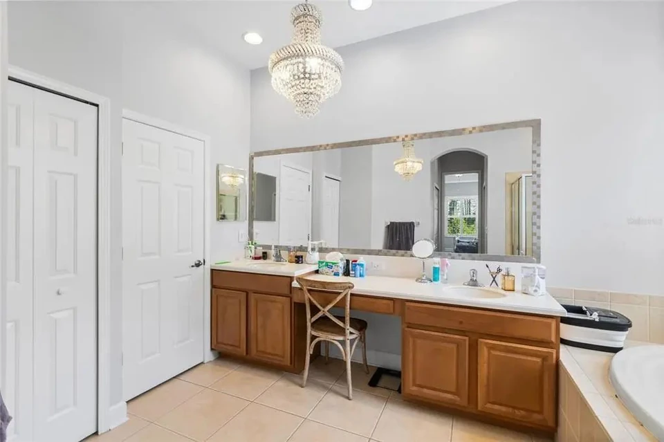 Primary bathroom with dual vanity at 9113 Creedmoor Lane