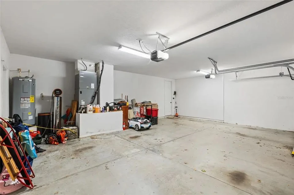 Three-car garage interior at 9113 Creedmoor Lane